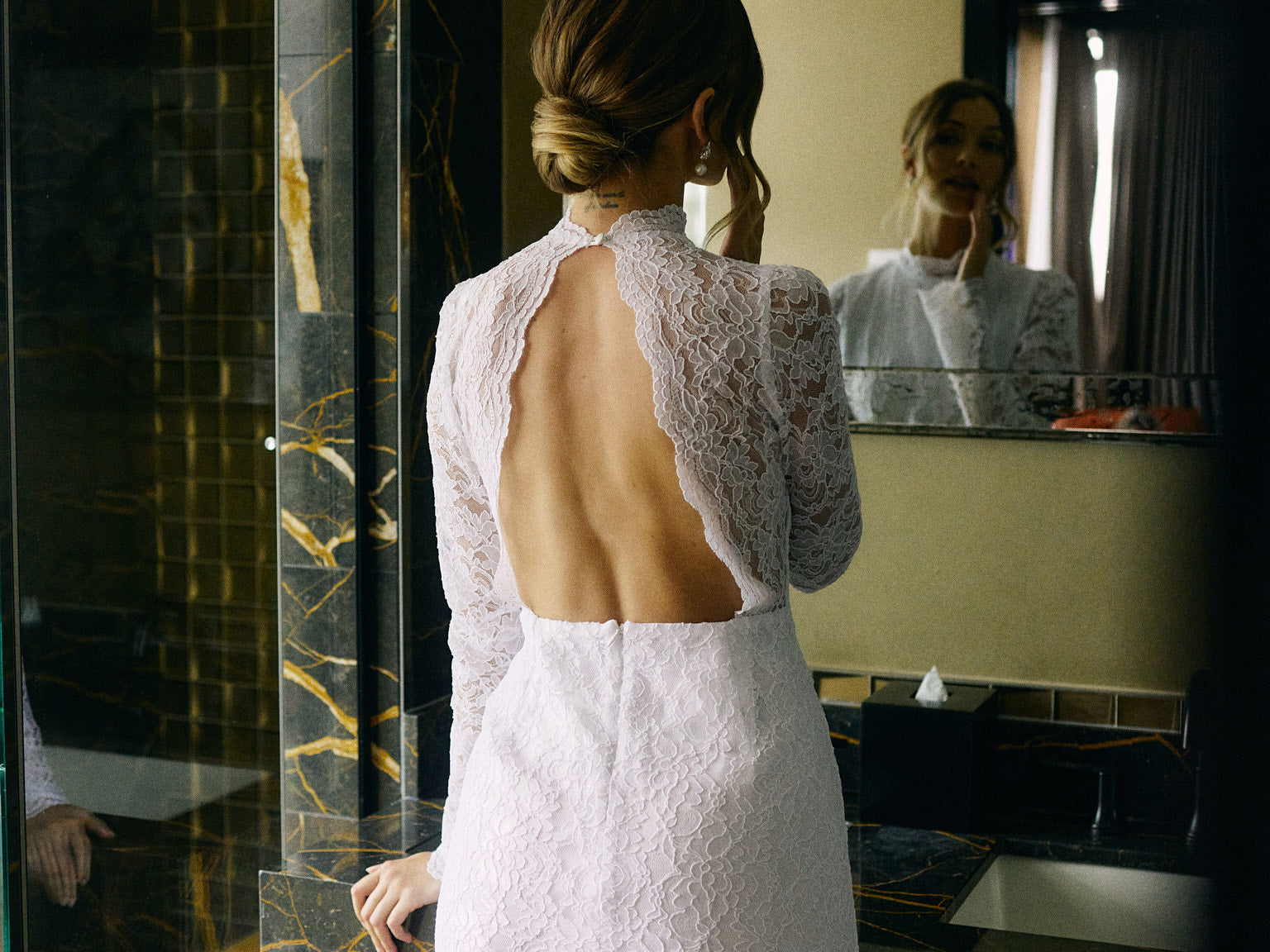 Long sleeve lace White Collection bridal event dress with cut out back detail..